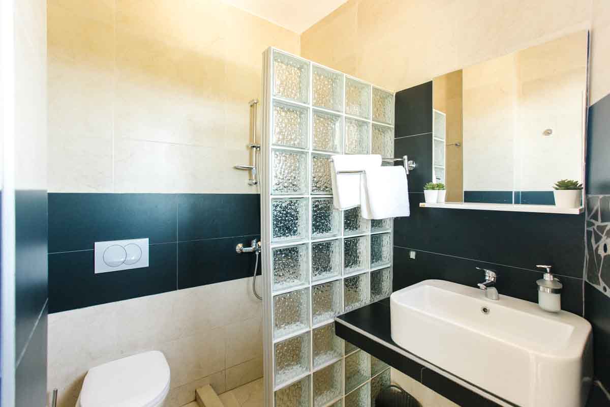 Dorm-room-shower-mahakala-center