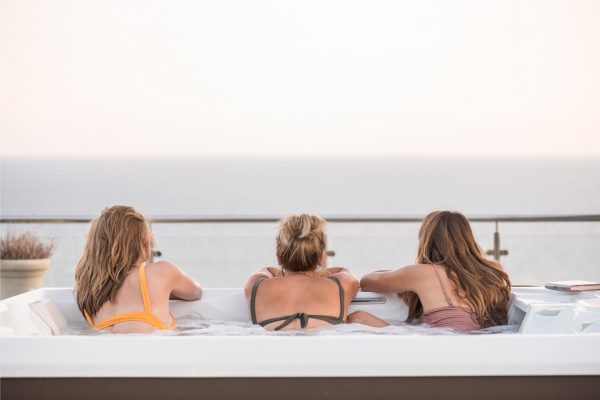 friends relaxing on a rooftop jacuzzi enjoying and loving life in Montenegro