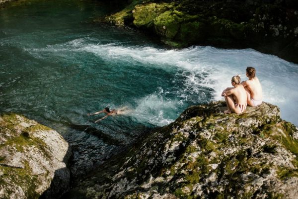 friends exploring beautiful lush nature and waterfalls at yoga retreat in Montenegro